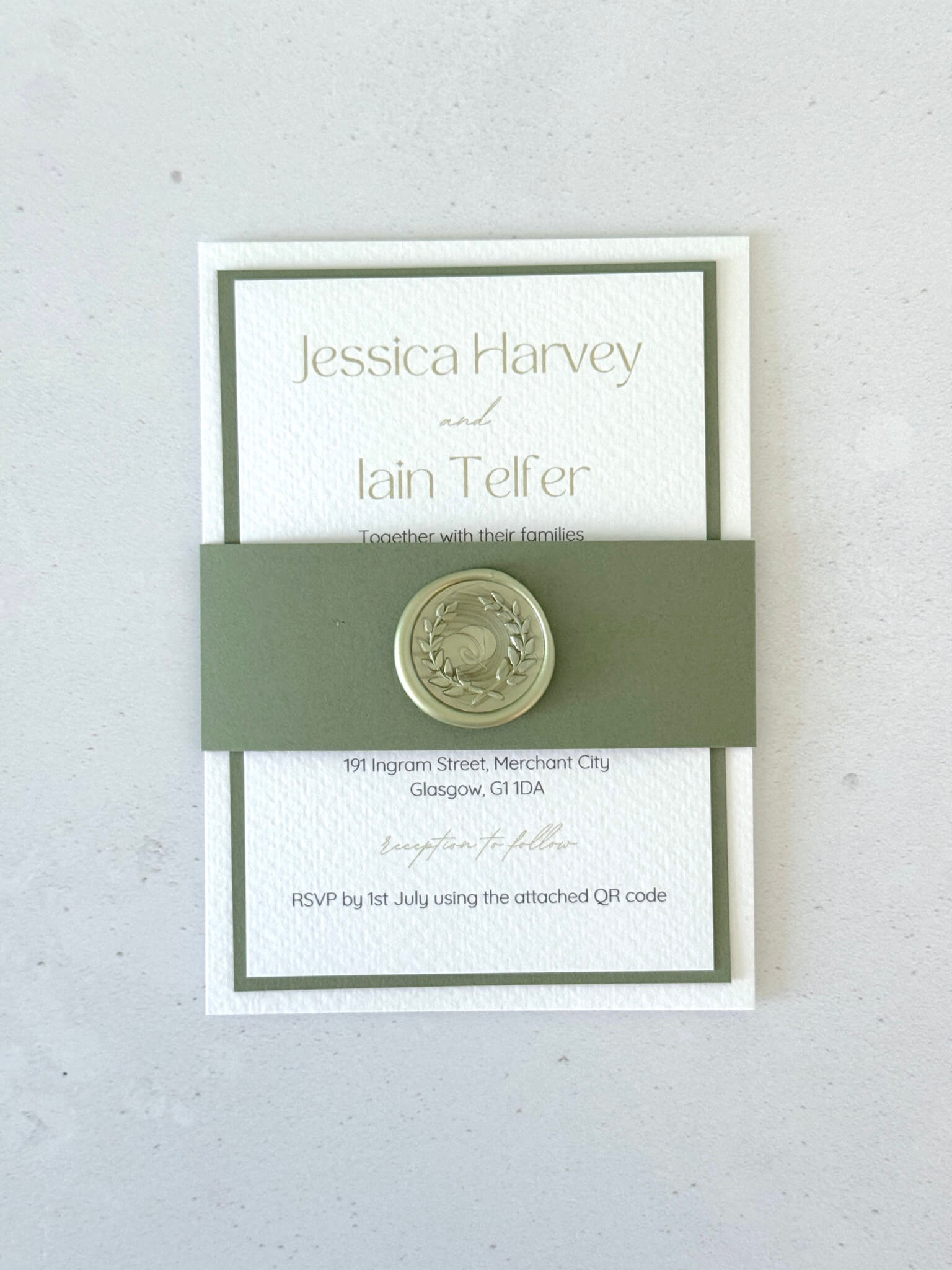 Layered wedding invite and info postcard with belly band and sage green wreath wax seal