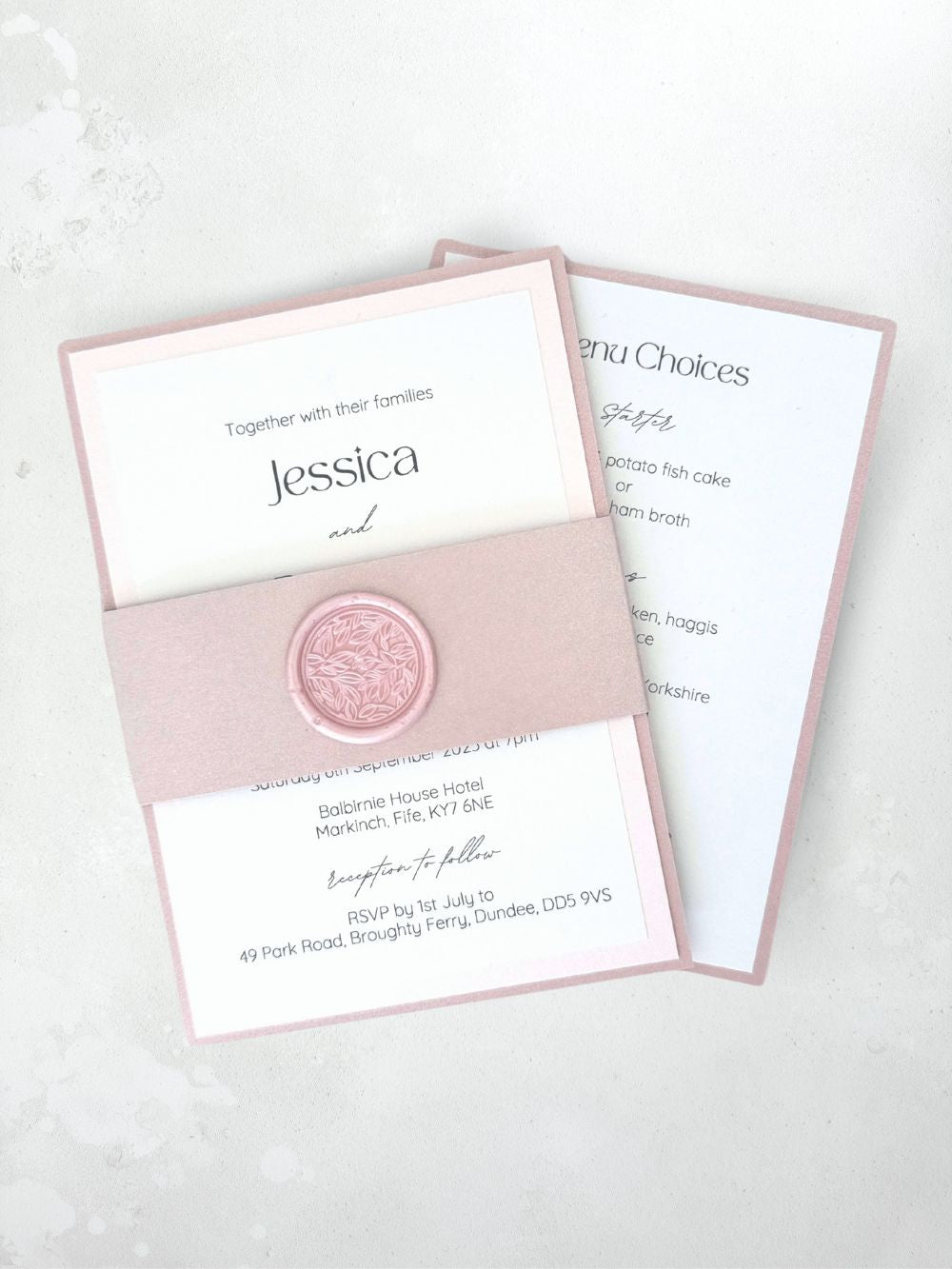 Dusky pink belly band wedding invite and details card with handmade foliage wax seal