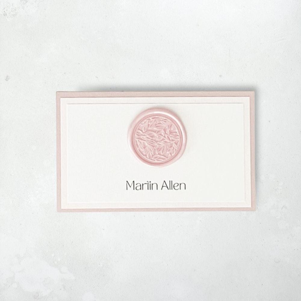 dusty pink wax seal printed place card on the day wedding stationery