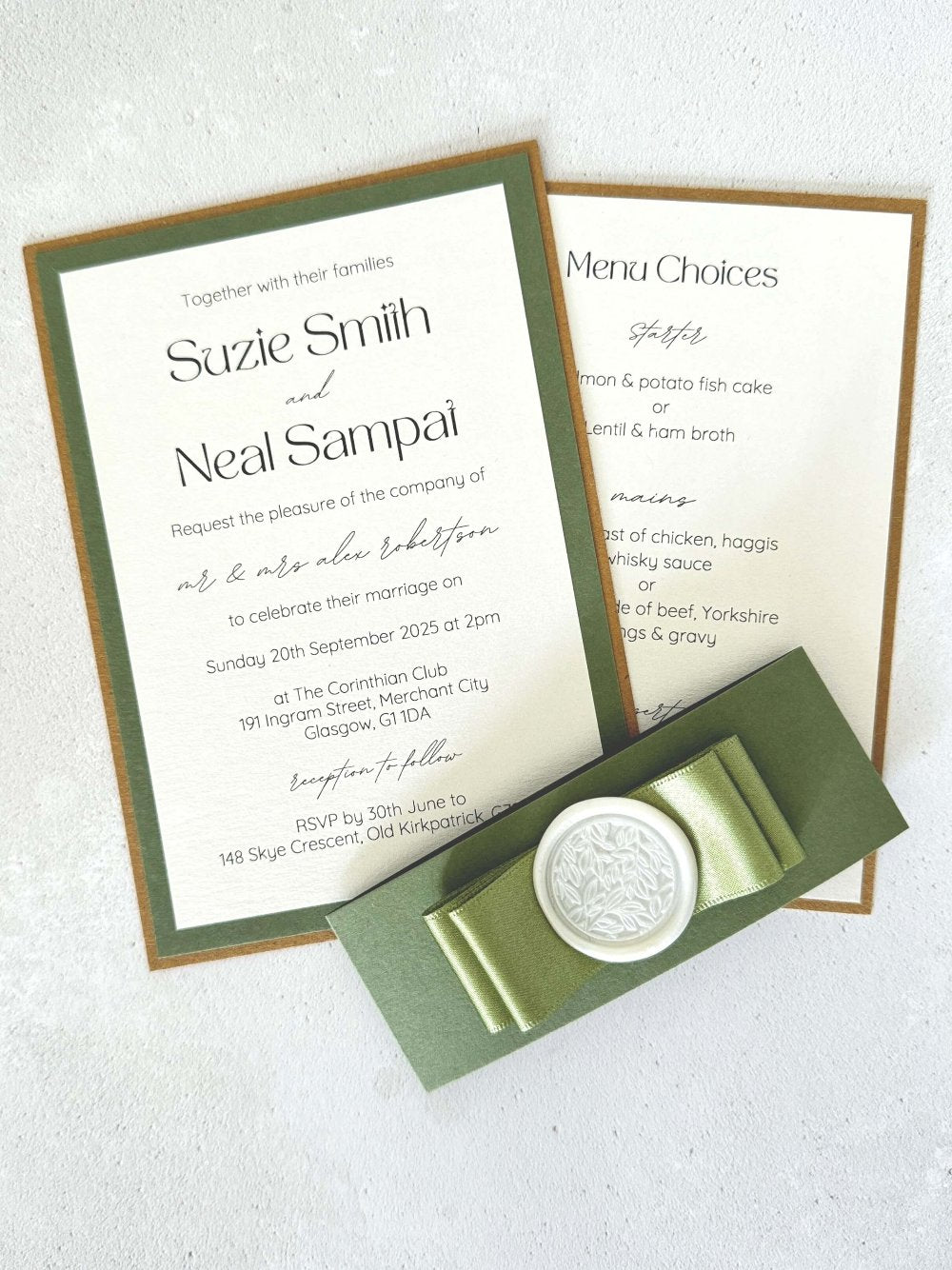 rustic sage green wedding invite with bow and wax seal belly band