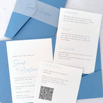 Dusky blue Sarah pocketfold wedding invite with 2 insert cards for menu and guest details, and QR code with vellum bellyband