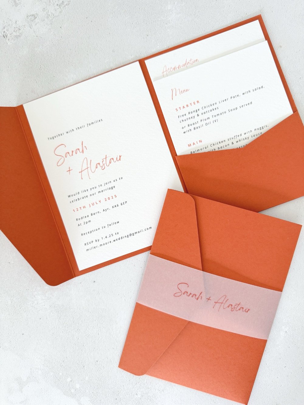 pocketfold wedding invite with 2 insert cards for menu and guest details, in burnt orange, with vellum belly band, handmade by zara scotland