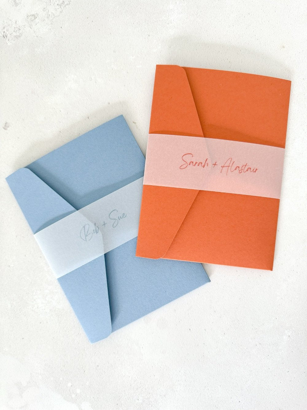 Pocketfold wedding invites with personalised vellum belly bands