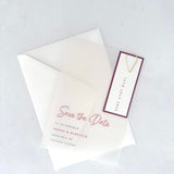 See through vellum save the date card with burgundy date tag and teardrop paperclip