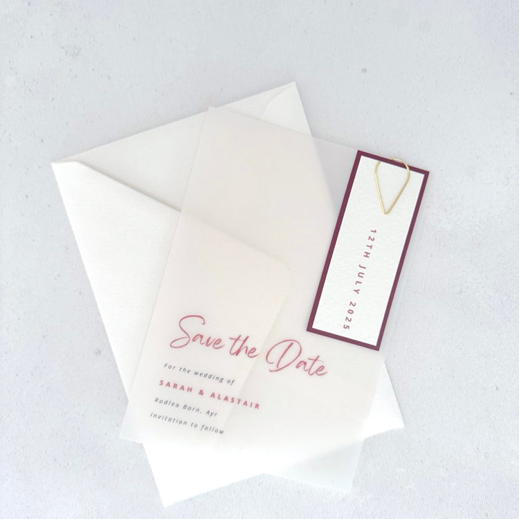 See through vellum save the date card with burgundy date tag and teardrop paperclip