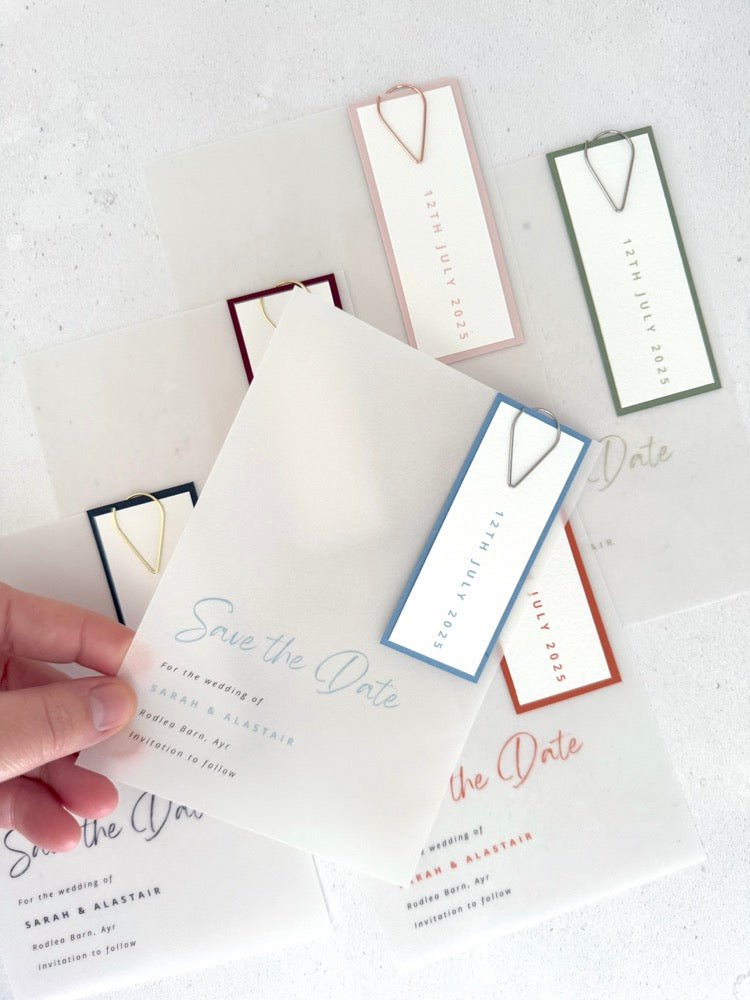 Handmade see through vellum save the date cards with coloured tags and teardrop paperclip in 6 colours