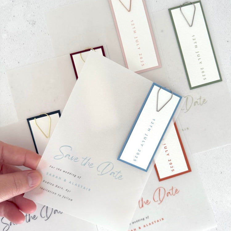 Handmade see through vellum save the date cards with coloured tags and teardrop paperclip in 6 colours