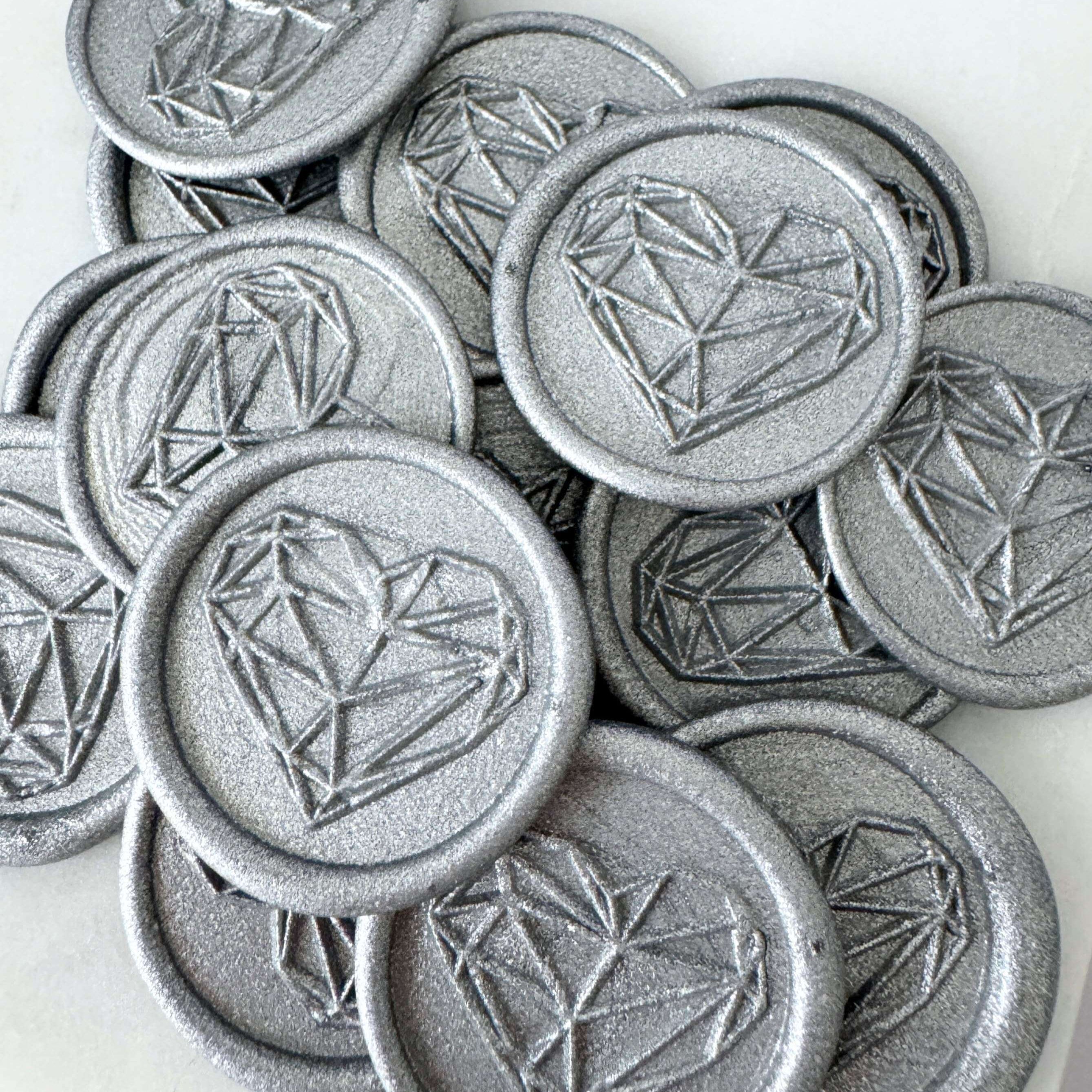 silver ready made wax seals with geometric heart design