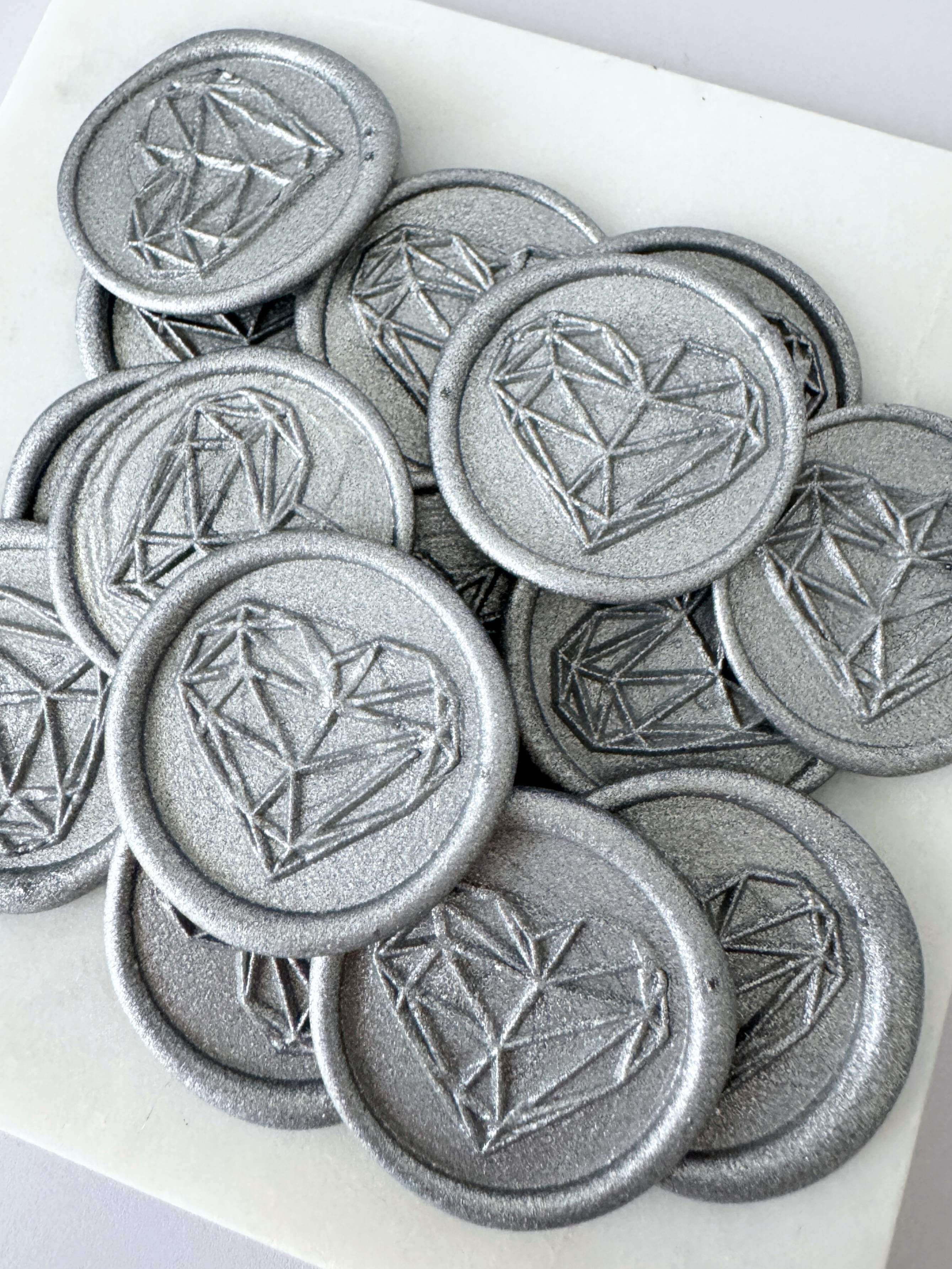 silver ready made wax seals with geometric heart design