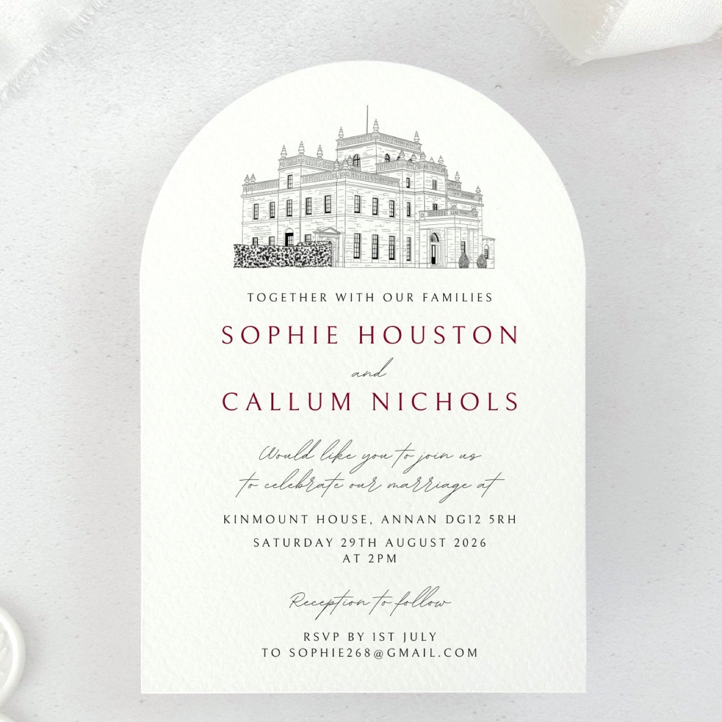 Arch shaped wedding invite with venue illustration of Kinmount House, Annan, Dumfries & Galloway, in burgundy