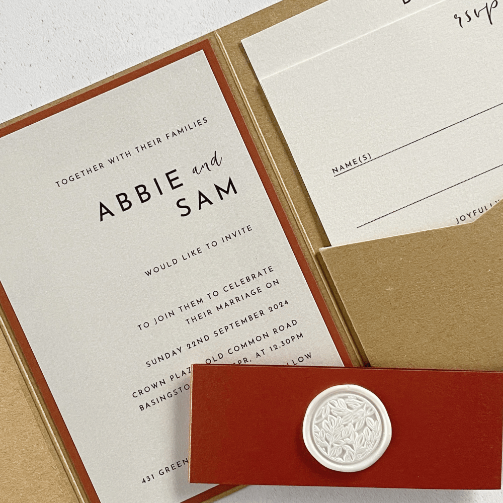 natural kraft and copper cinnamon belly band pocket invitations