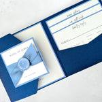 Ailsa pocketfold wedding invitation in navy and cornflower blue satin ribbon and wax seal with guest info inserts