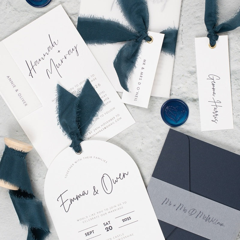 Navy wedding invites with silk ribbons and wax seals. Book in for later