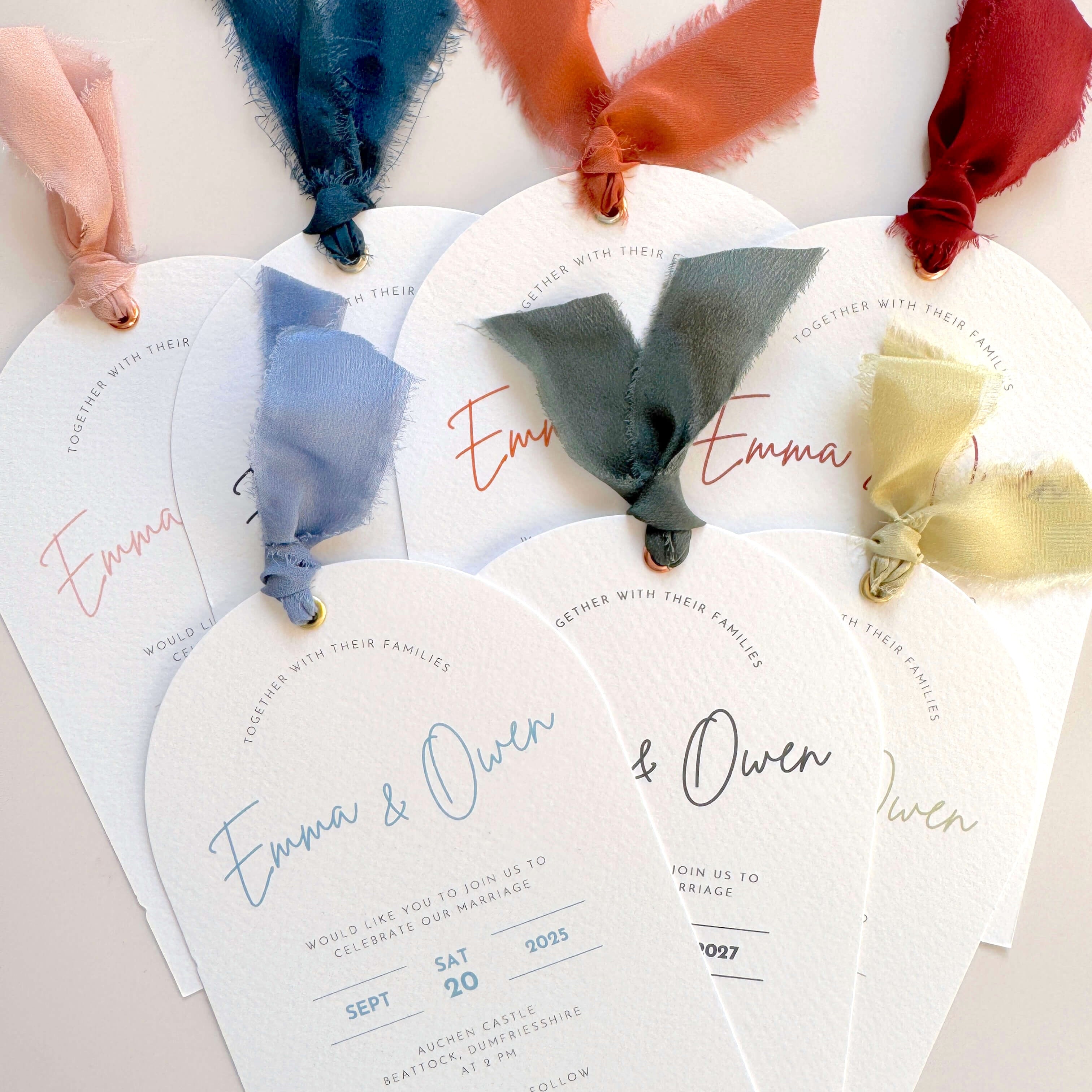Handmade Emma arch wedding invite with silk ribbon and metal eyelet, in rust, navy, burgundy, sage green, dusky blue, pink, and dark green