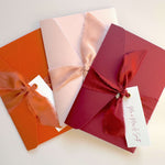Emma pocketfold wedding invite in burgundy, blush pink, and rusty orange by handmade by zara