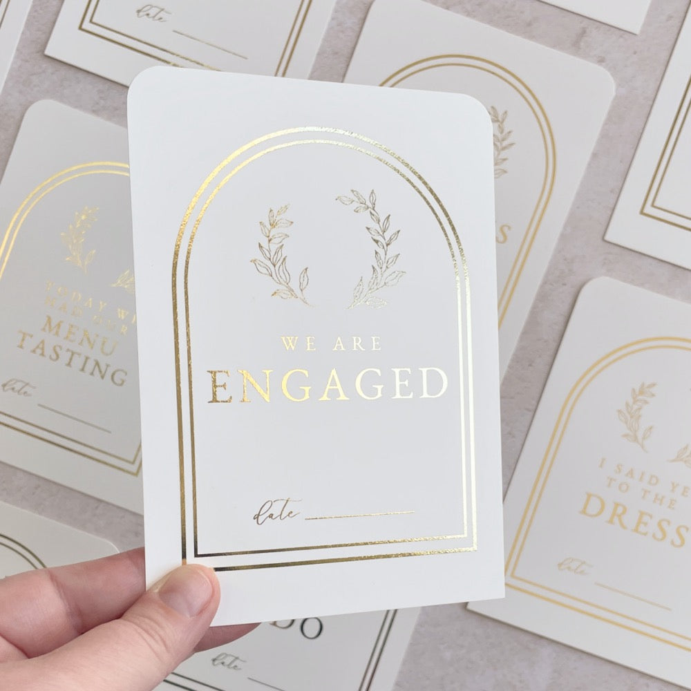 gold wreath engagement milestone cards for wedding planning