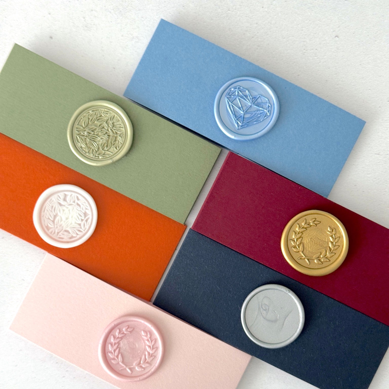 6 colour options of belly band with wax seals finishing touch for venue illustration wedding invites