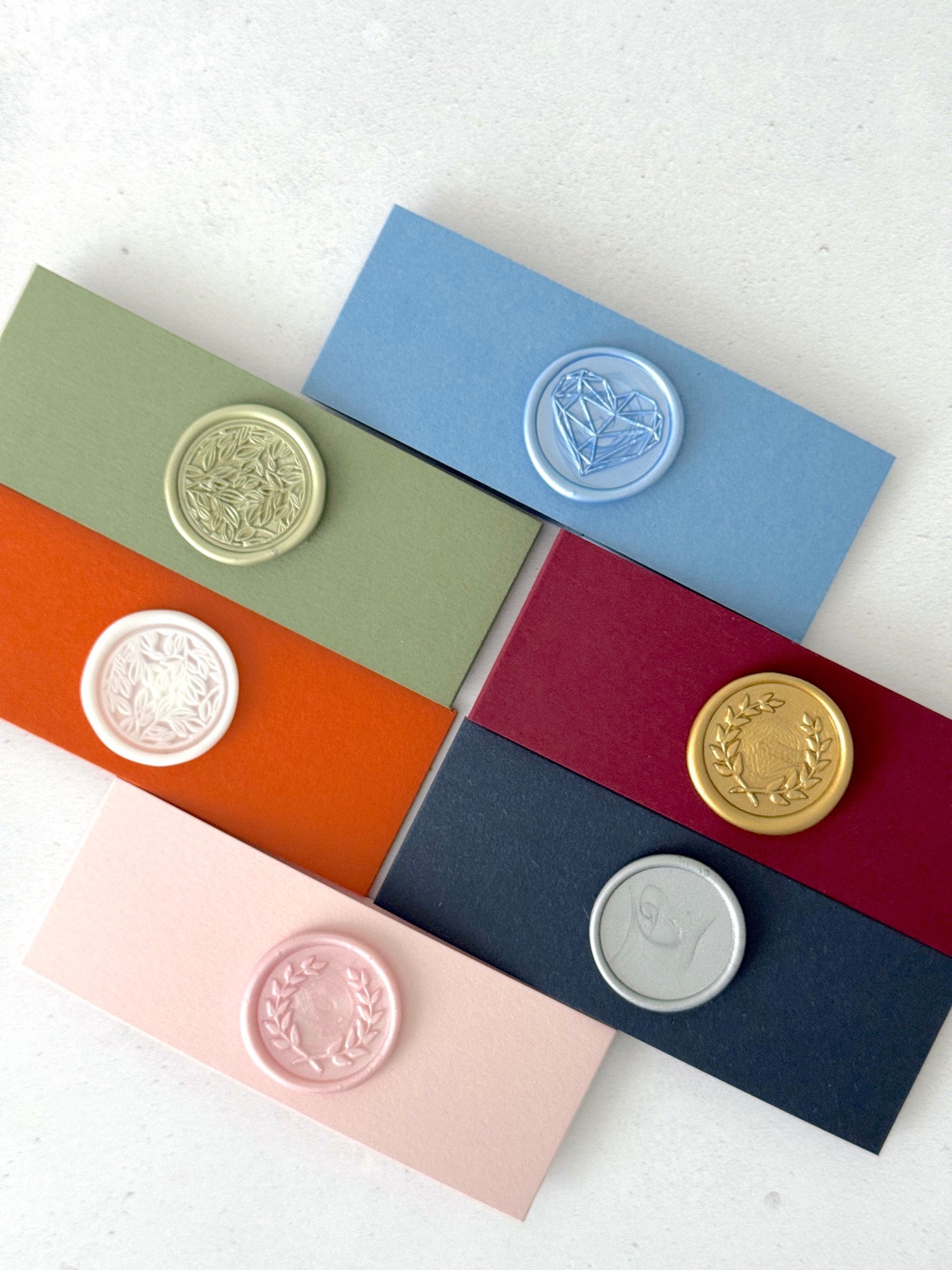 6 colour options of belly band with wax seals finishing touch for venue illustration wedding invites