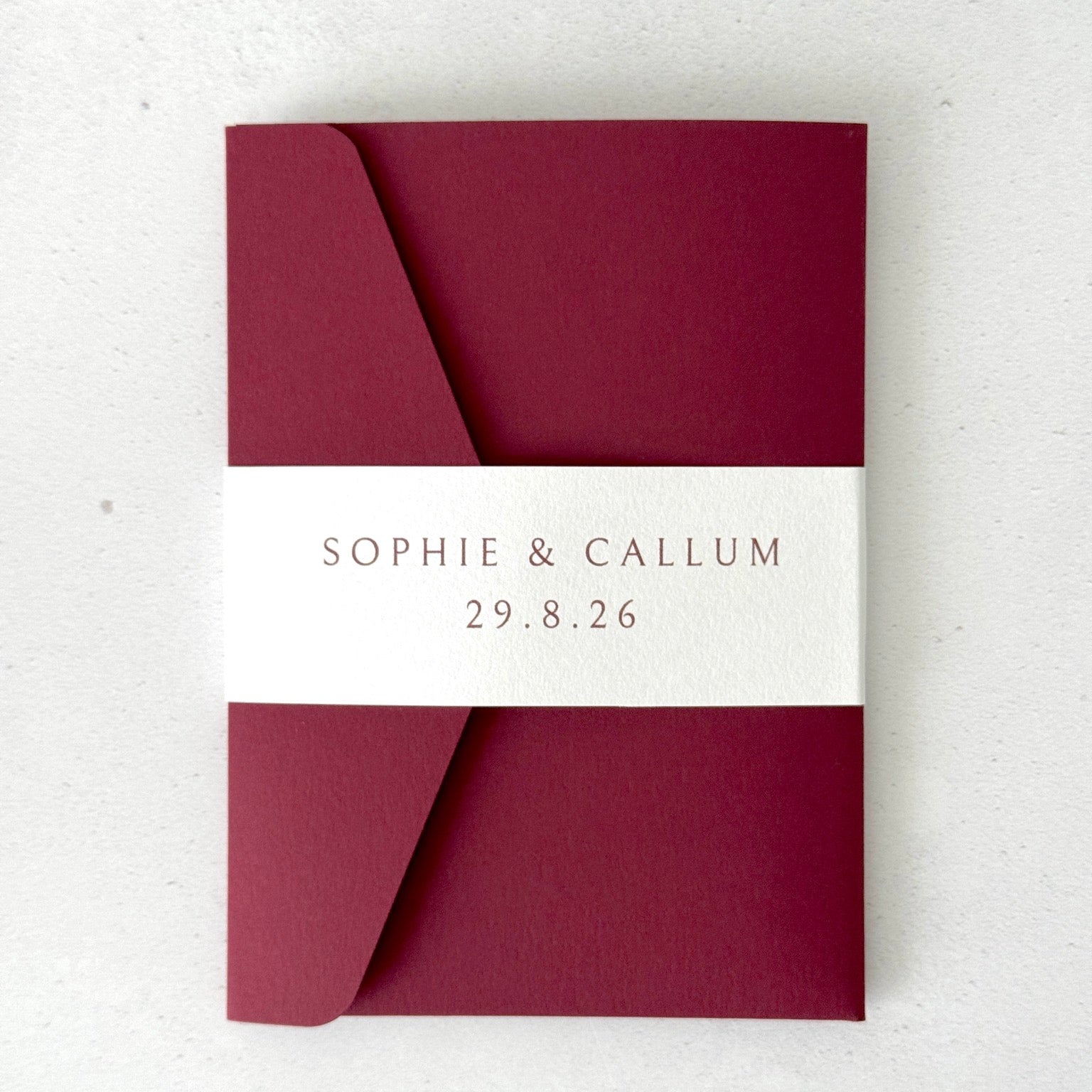 burgundy red personalised with couples names and wedding date on white belly band