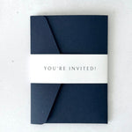 navy wedding invite with personalised printed bellyband.