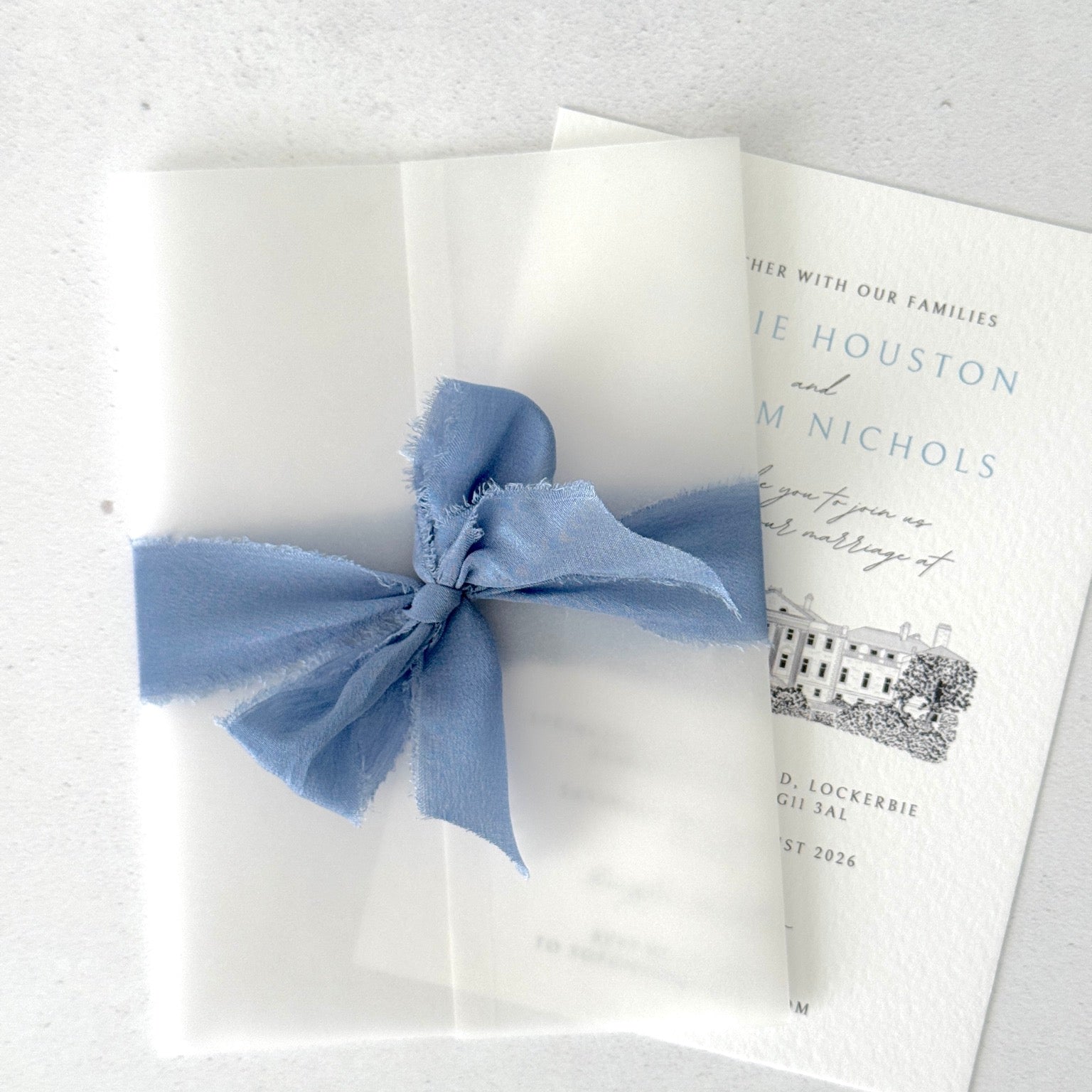 Vellum wrap and silk ribbon finishing touch to venue illustration