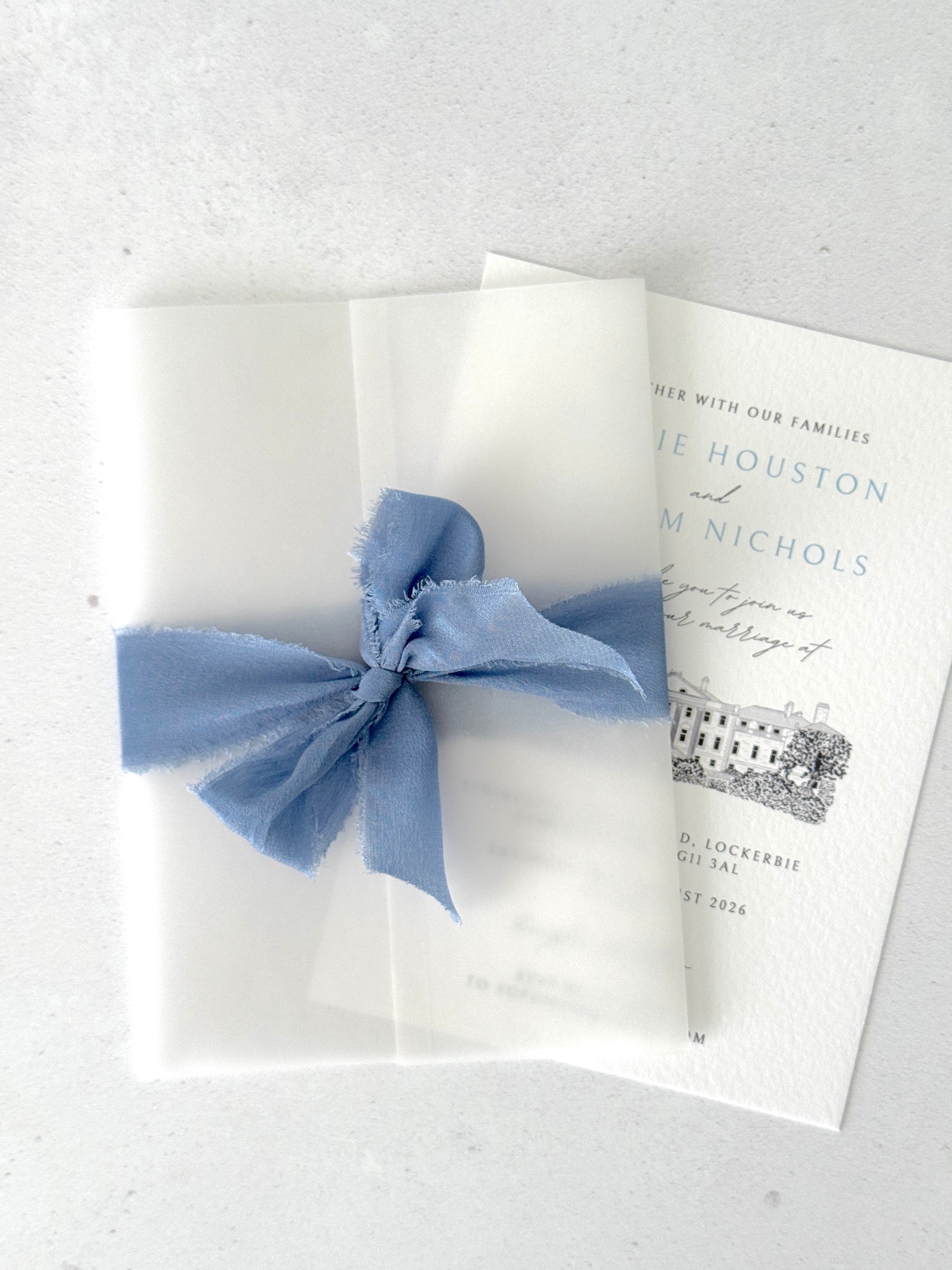 Vellum wrap and silk ribbon finishing touch to venue illustration
