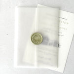 finishing touch for wedding invite with vellum jacket and handmade wax seal