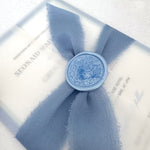 Jeni tied silk ribbon invite in dusky blue with info card and transparent vellum wrap handmade by zara dumfries