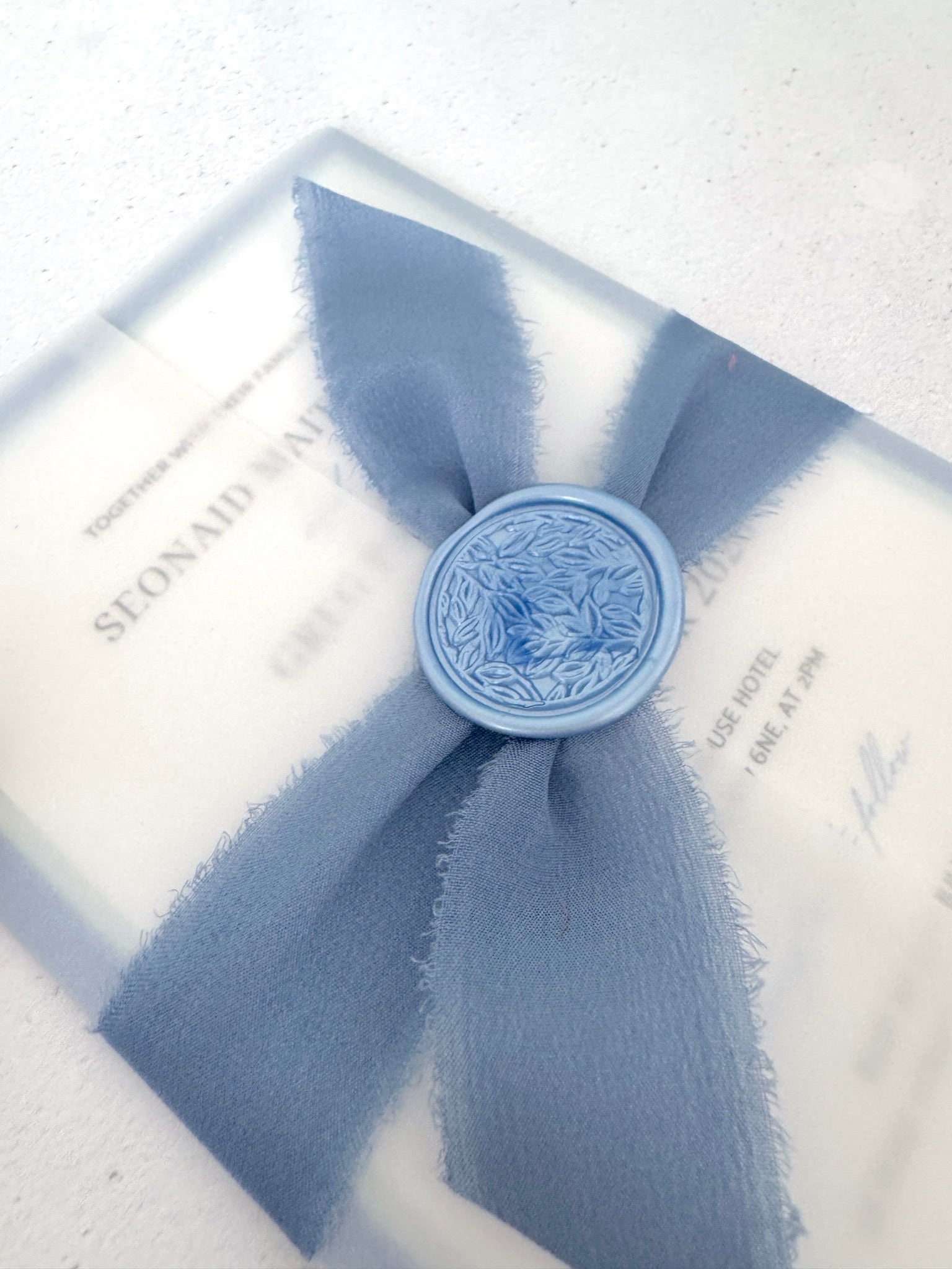 Jeni tied silk ribbon invite in dusky blue with info card and transparent vellum wrap handmade by zara dumfries