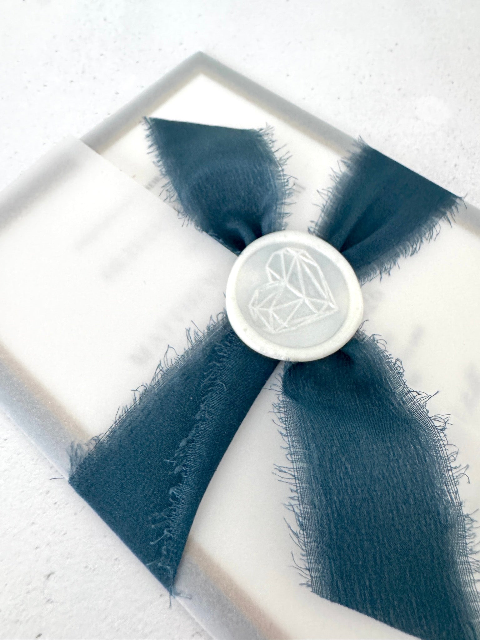 Navy blue tied silk ribbon and pearl wax seal wedding invite