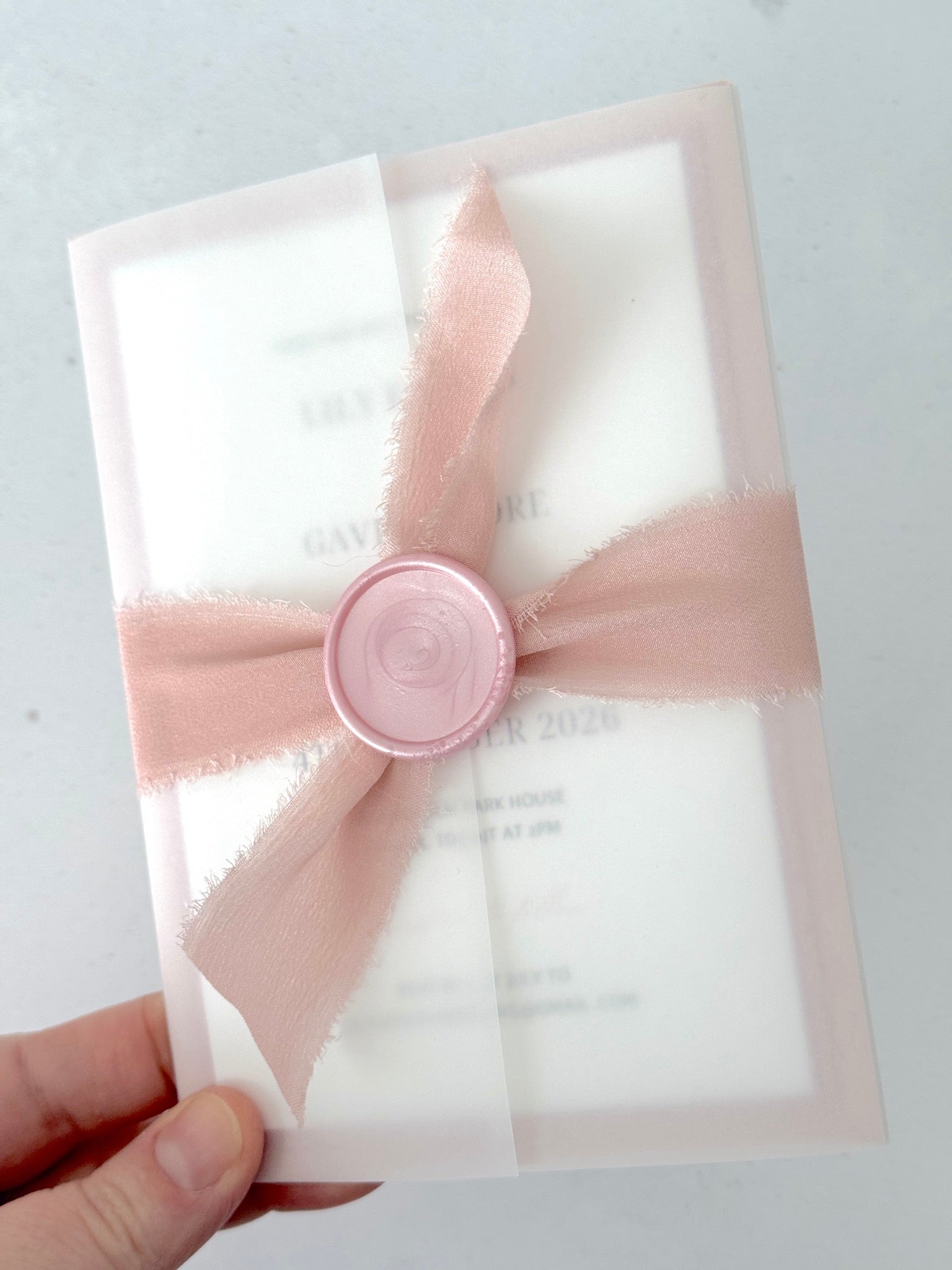 Blush Pink silk ribbon and wax sealed vellum wedding invite