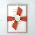 Transparent paper jacket wedding invite with tied silk ribbon