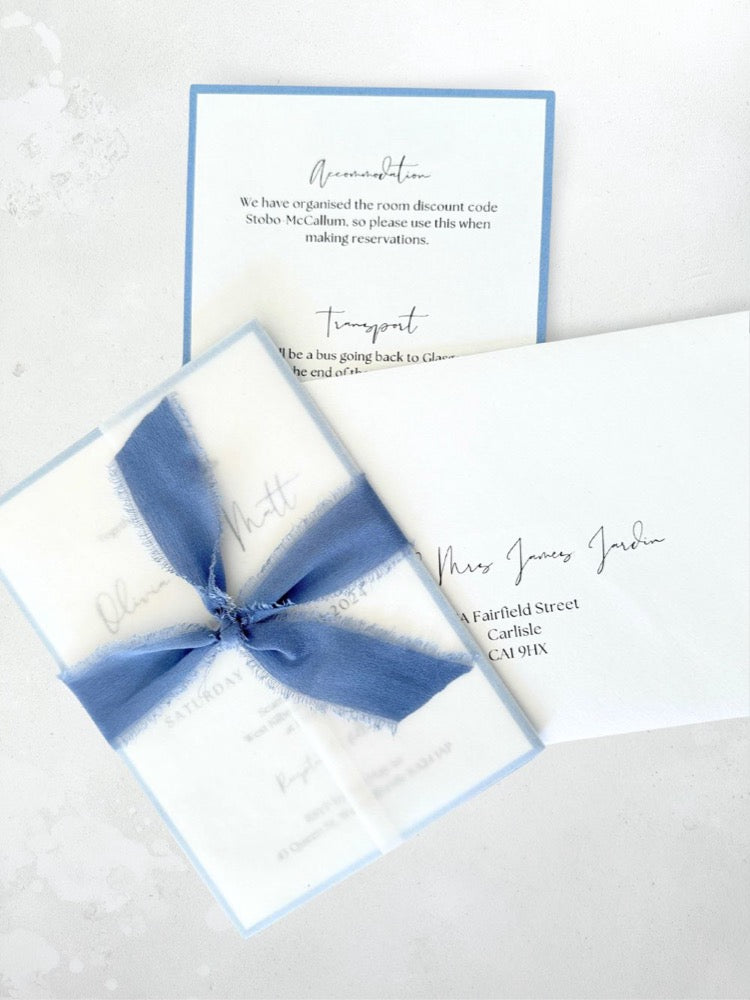 Jeni tied silk ribbon invite in dusky blue with info card and transparent vellum wrap handmade by zara dumfries