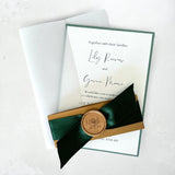 Emerald green satin ribbon with gold wax seal vellum jacket wedding invite handmade by zara dumfries