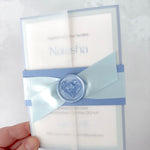 Lyn Vellum jacket wedding with cornflower blue belly band and wax seal, baby blue satin ribbon