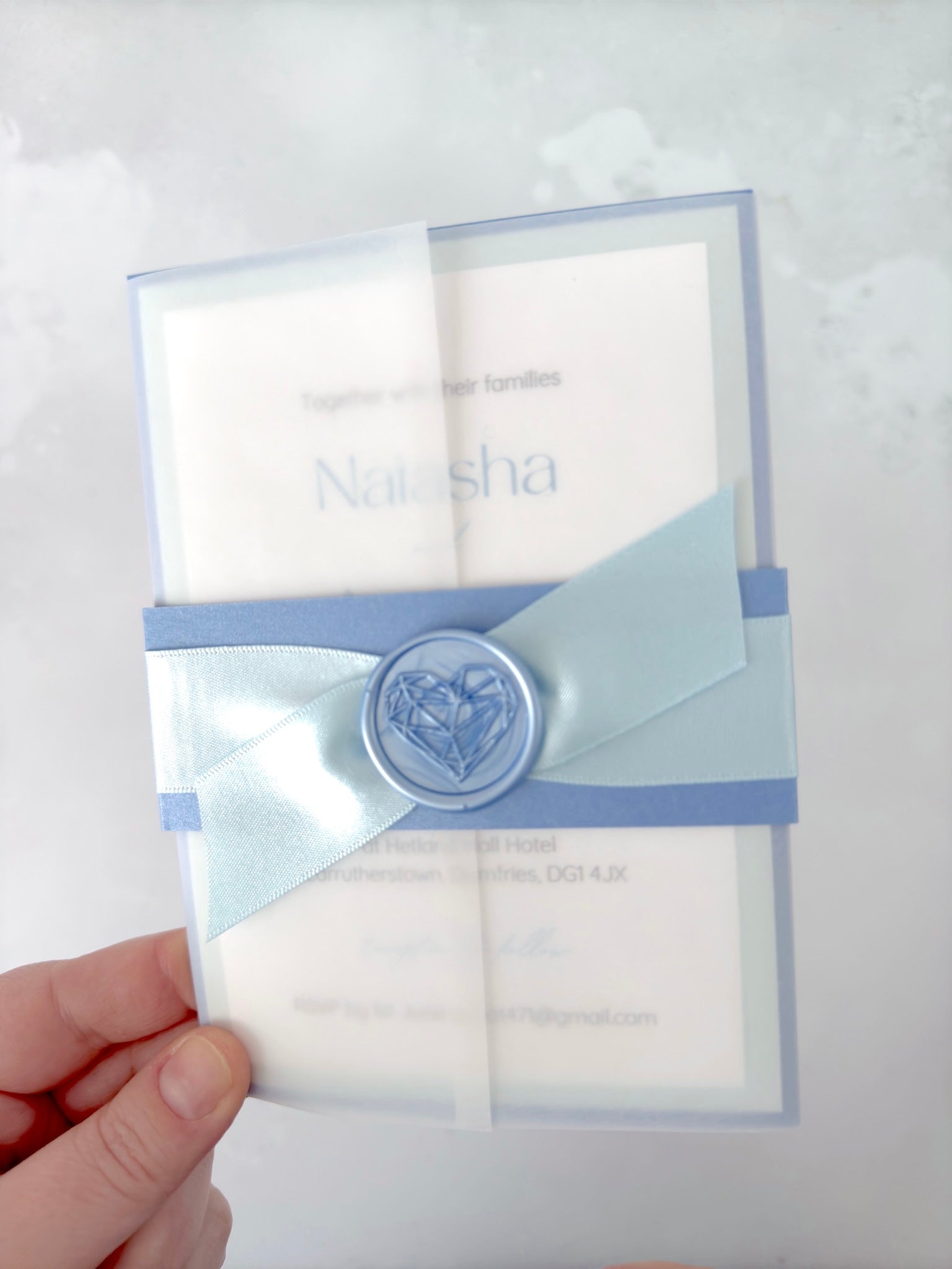 Lyn Vellum jacket wedding with cornflower blue belly band and wax seal, baby blue satin ribbon