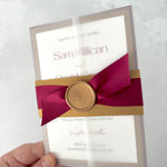 Lyn burgundy red and gold vellum wrapped wedding invite with belly band and wax seal