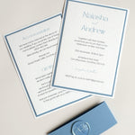 dusty cornflower blue postcard wedding invite and details card with belly band and handmade rose wax seal