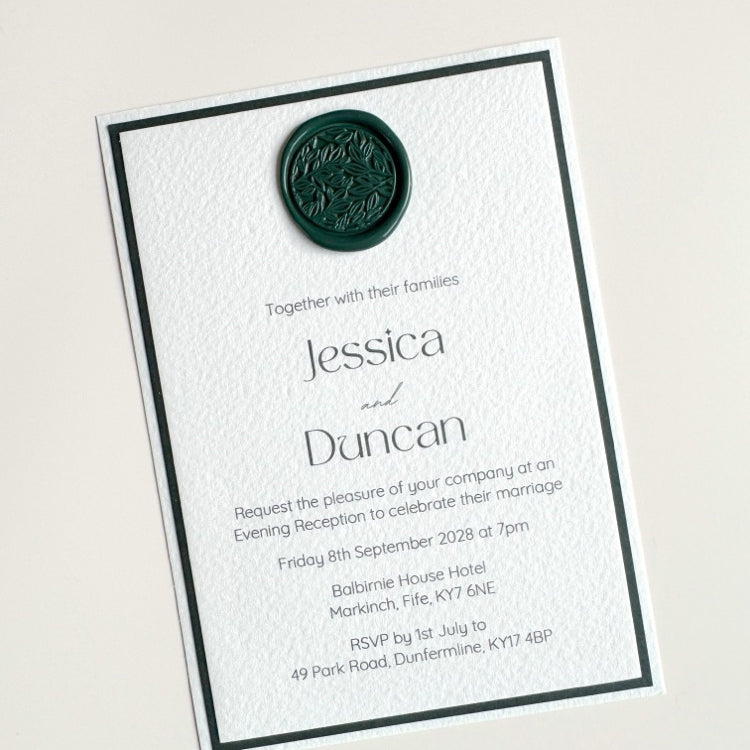 Lyn evening wedding invite in white and forest green with dark green foliage handmade wax seal