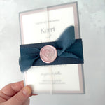 Navy wedding invite with belly band and vellum wrap