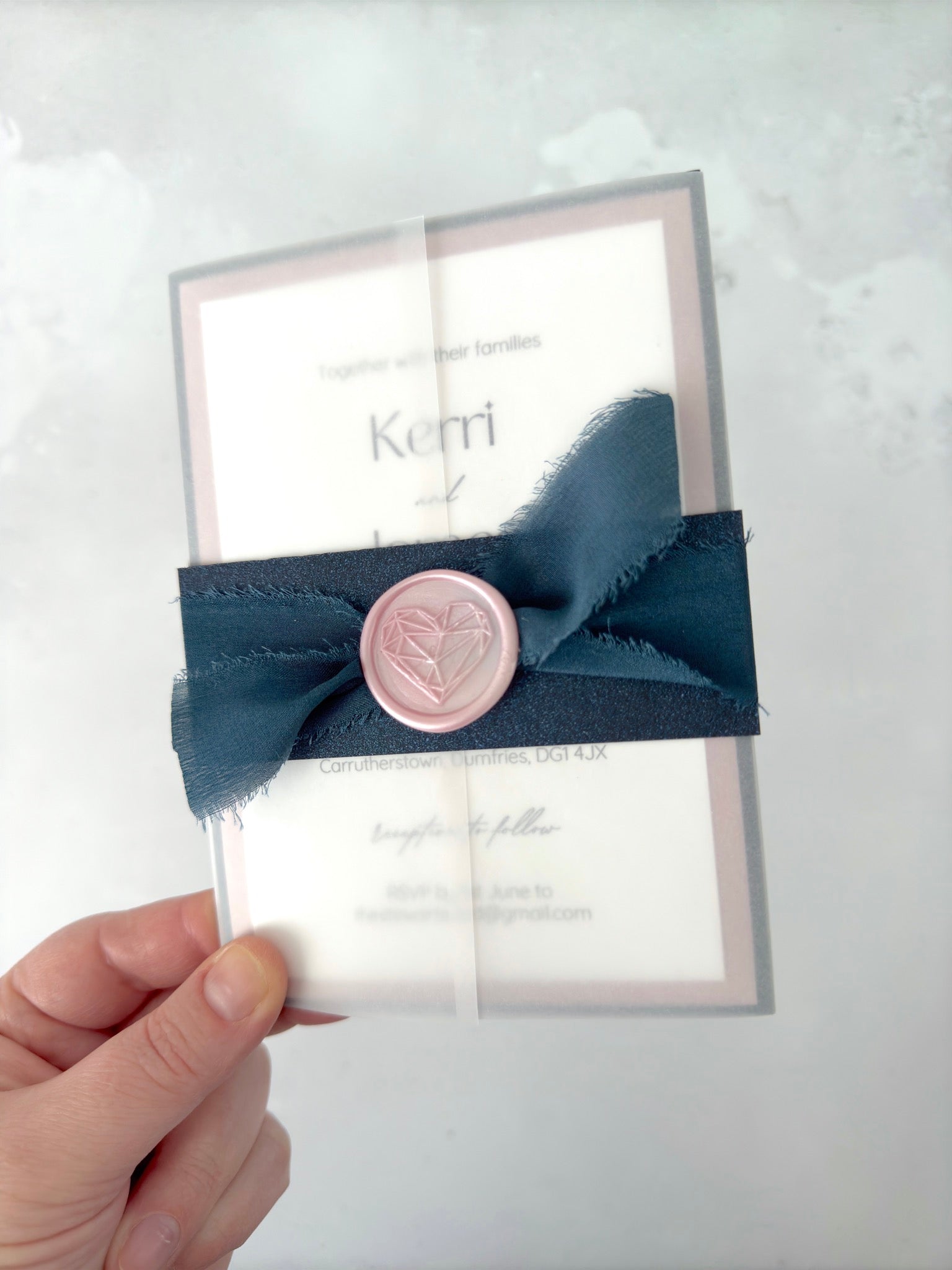 Navy wedding invite with belly band and vellum wrap