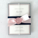 transparent paper sleeve wedding invitation with belly band, satin ribbon, and wax seal