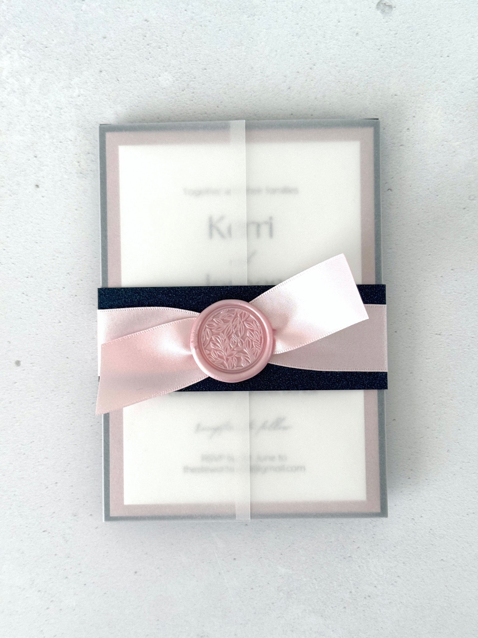 transparent paper sleeve wedding invitation with belly band, satin ribbon, and wax seal