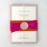 transparent paper wrap wedding invitation with pink and orange belly band