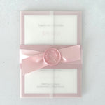 Belly band wedding invite in transparent paper in pink