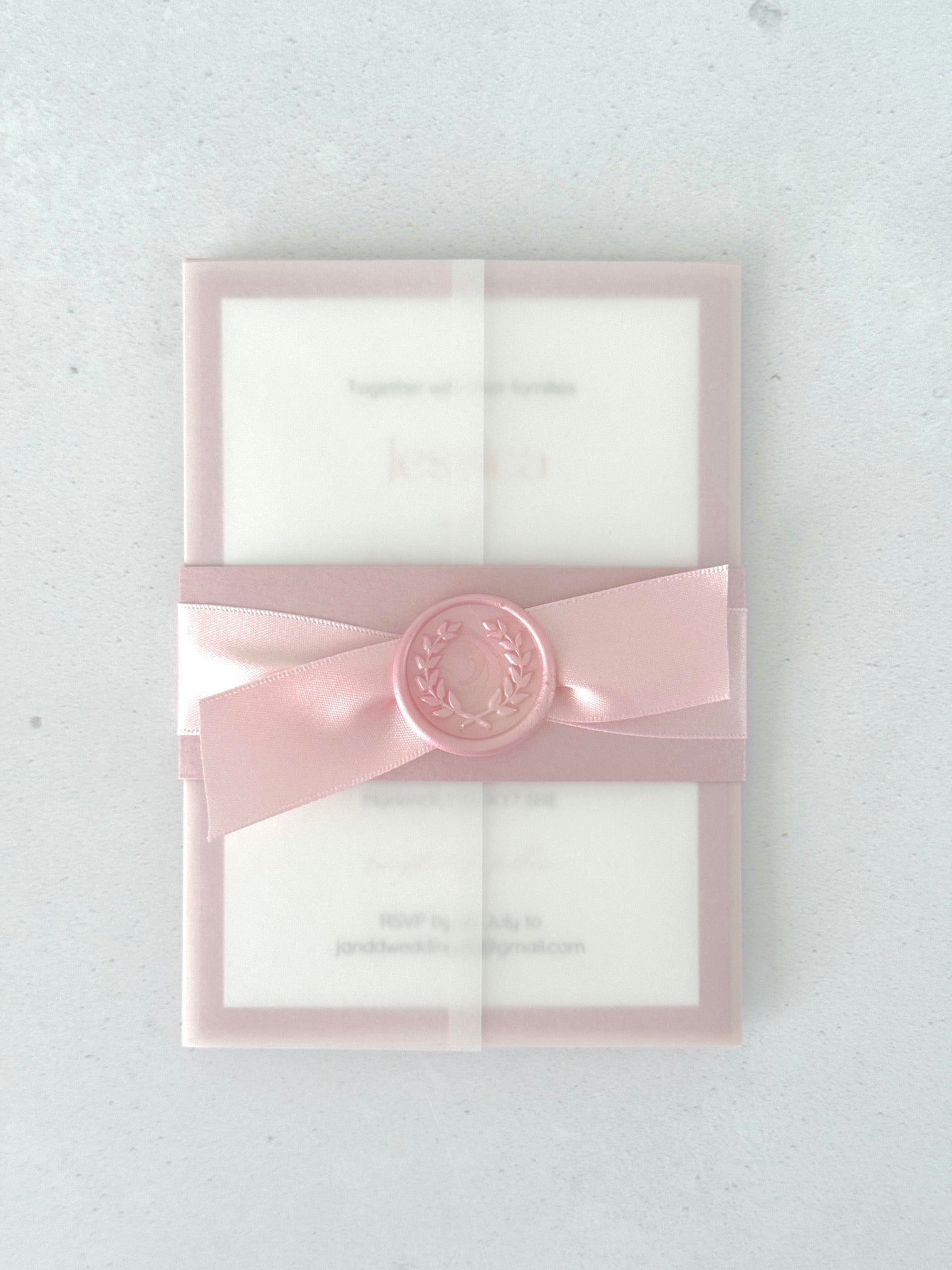 Belly band wedding invite in transparent paper in pink