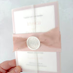 Vellum wedding invitation with belly band and silk ribbon, with white wax seal