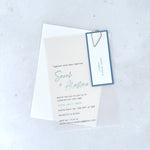 Sarah transparent vellum wedding invite with dusky blue name tag and silver teardrop paperclip 