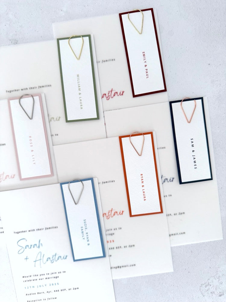 Handmade see through vellum wedding invites  with paperclip guest name tags in 6 colours