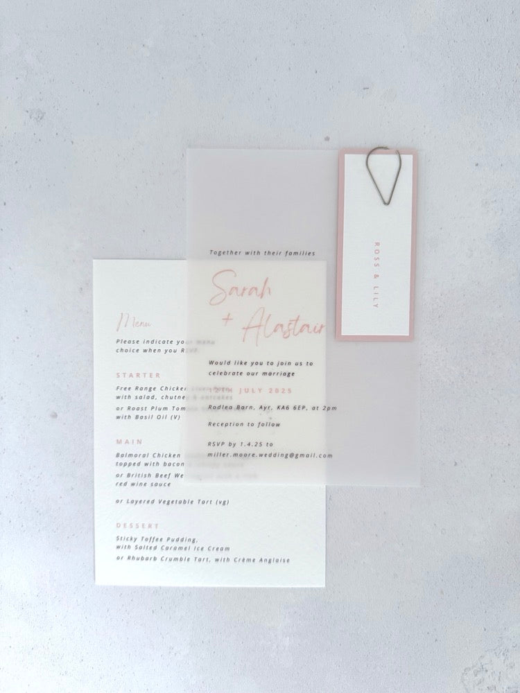 Sarah transparent vellum wedding invite with blush pink name tag and teardrop paperclip and details card for menu options